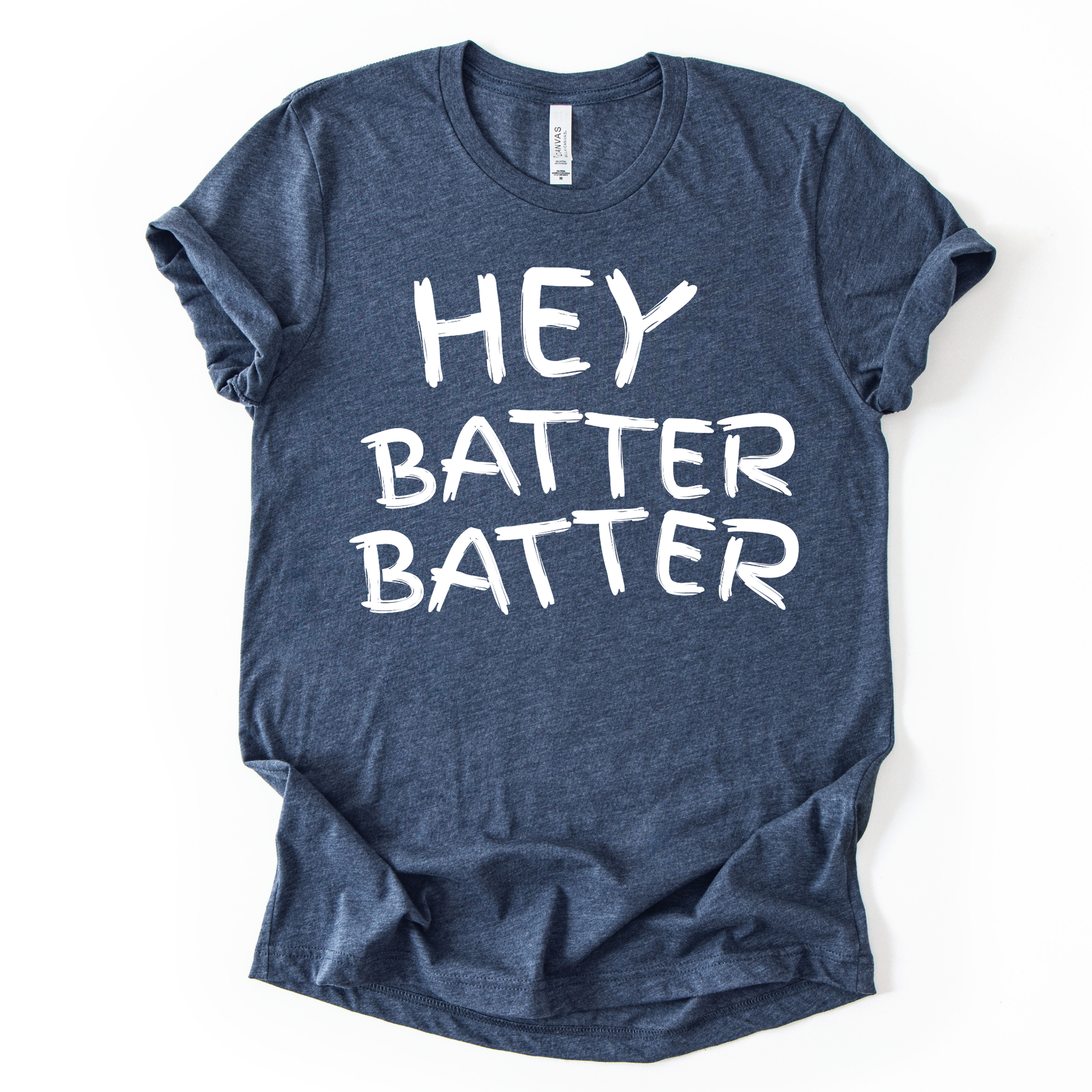 Blue t-shirt with 'HEY BATTER BATTER' text on a white background