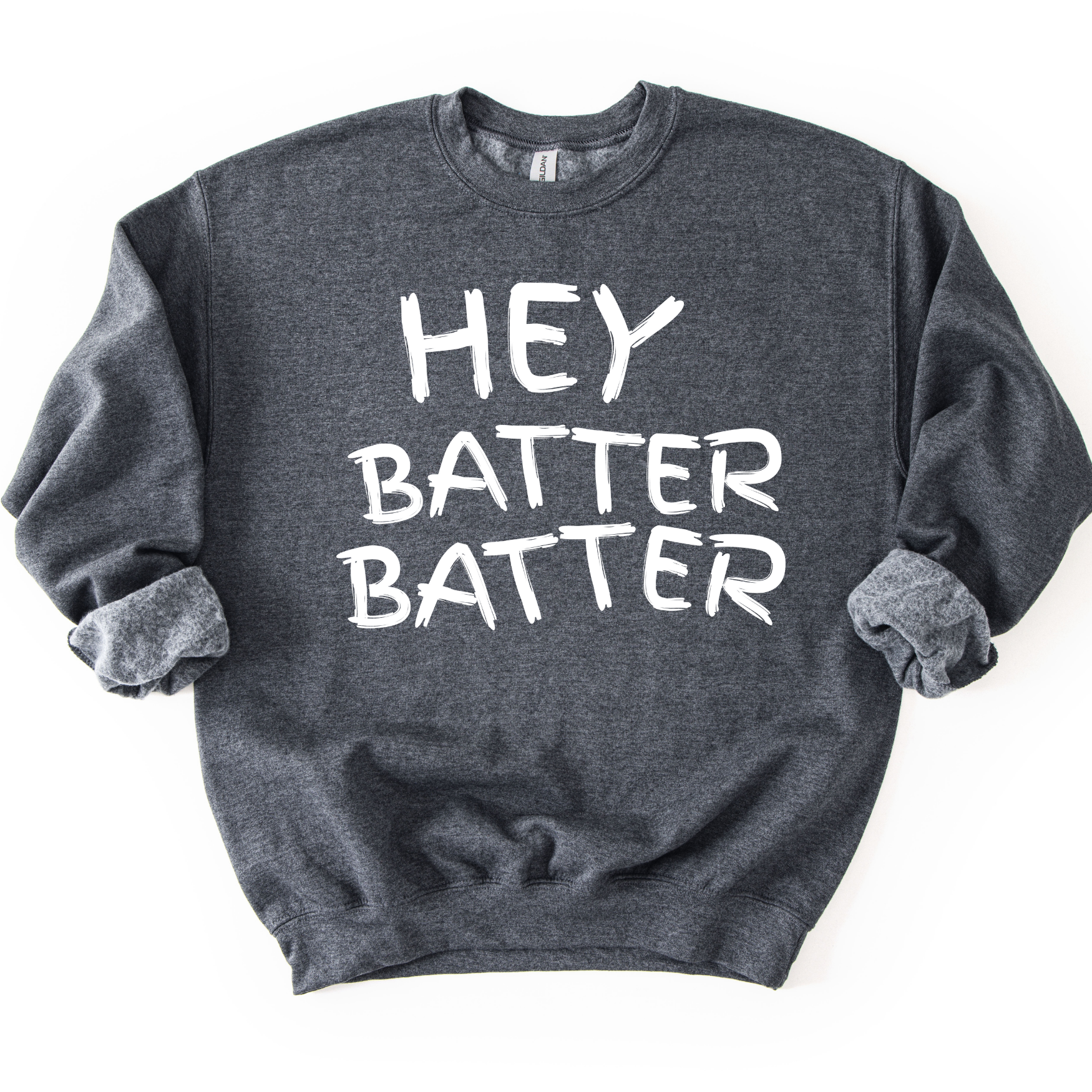 Dark heather gray crewneck sweatshirt with white hand-drawn style lettering reading “Hey Batter Batter,” styled flat with sleeves scrunched