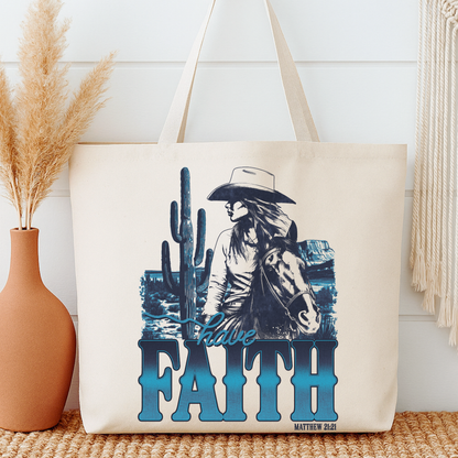 Tote bag with a cowboy and cactus design and 'Have Faith' text, placed on a surface with decorative elements.