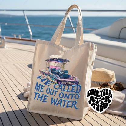 Tote bag with boat graphic and text on a boat deck with ocean view.  He called me out onto the water