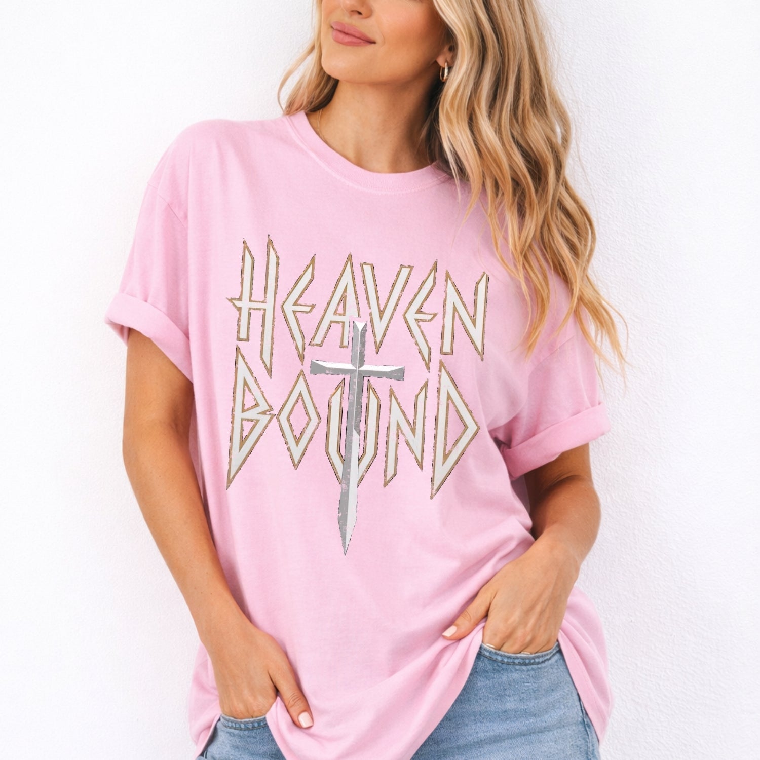 Woman wearing a pink t-shirt with 'Heaven Bound' text and cross graphic on a white background