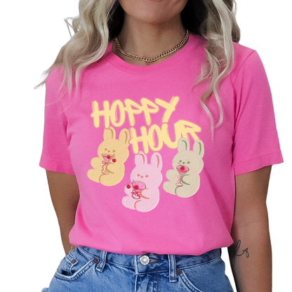 Heather Charity Pink Playful Easter graphic on a Bella Canvas t-shirt. The design features a relaxed pink bunny illustration paired with the bold phrase “Hoppy and Unbothered” in modern, oversized lettering. The artwork blends trendy humor with soft seasonal styling, making it a fun spring statement piece.