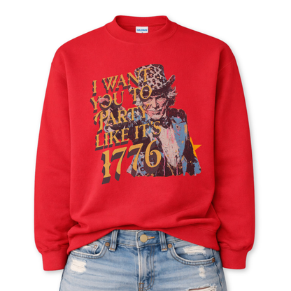 Patriotic Uncle Sam graphic on a red sweatshirt. The design features a distressed illustrated portrait of Uncle Sam wearing a patterned top hat, paired with bold vintage-style text reading “I Want You to Party Like It’s 1776.” Layered textures, muted patriotic tones, and worn ink details give the artwork a retro Americana feel. A bold, playful patriotic design suited for Fourth of July, summer celebrations, and USA-themed seasonal collections.