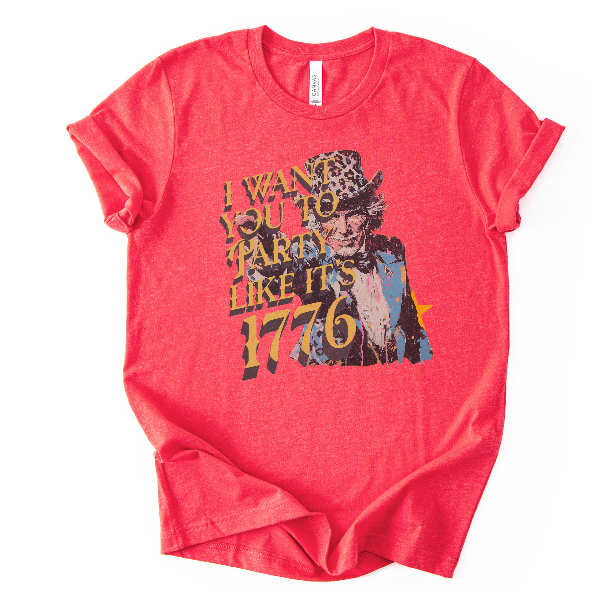 Vintage patriotic 1776 graphic on a red t-shirt. The design features an illustrated Uncle Sam portrait with distressed textures and bold gold lettering reading “I Want You to Party Like It’s 1776.” The artwork blends Revolutionary War imagery with modern, playful Fourth of July messaging, creating a nostalgic Americana look ideal for Independence Day and summer patriotic collections.