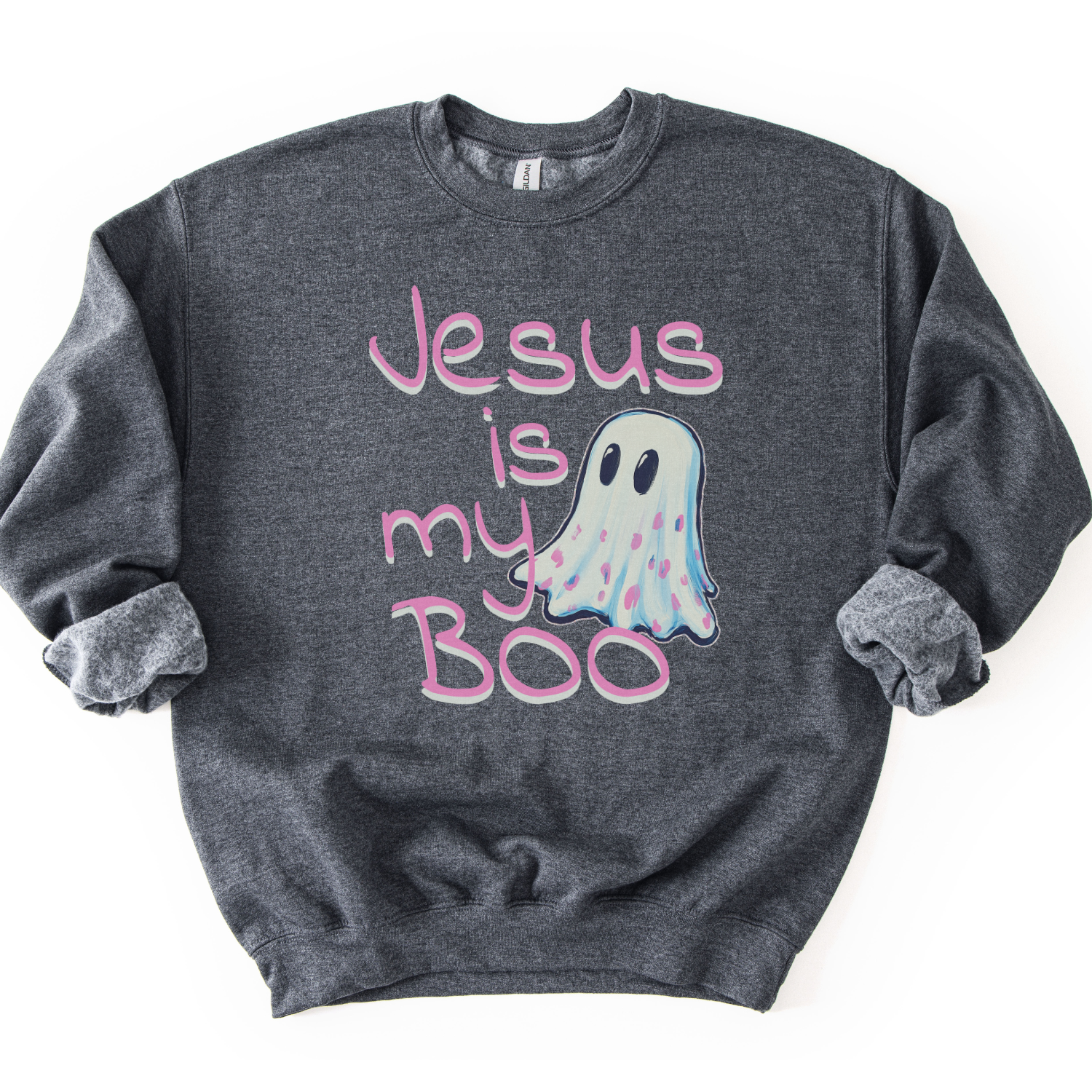 A dark heather gray crewneck sweatshirt featuring a graphic print that reads 'Jesus is my Boo' in pink script, accompanied by a cute pastel ghost illustration, laid flat on a white background.