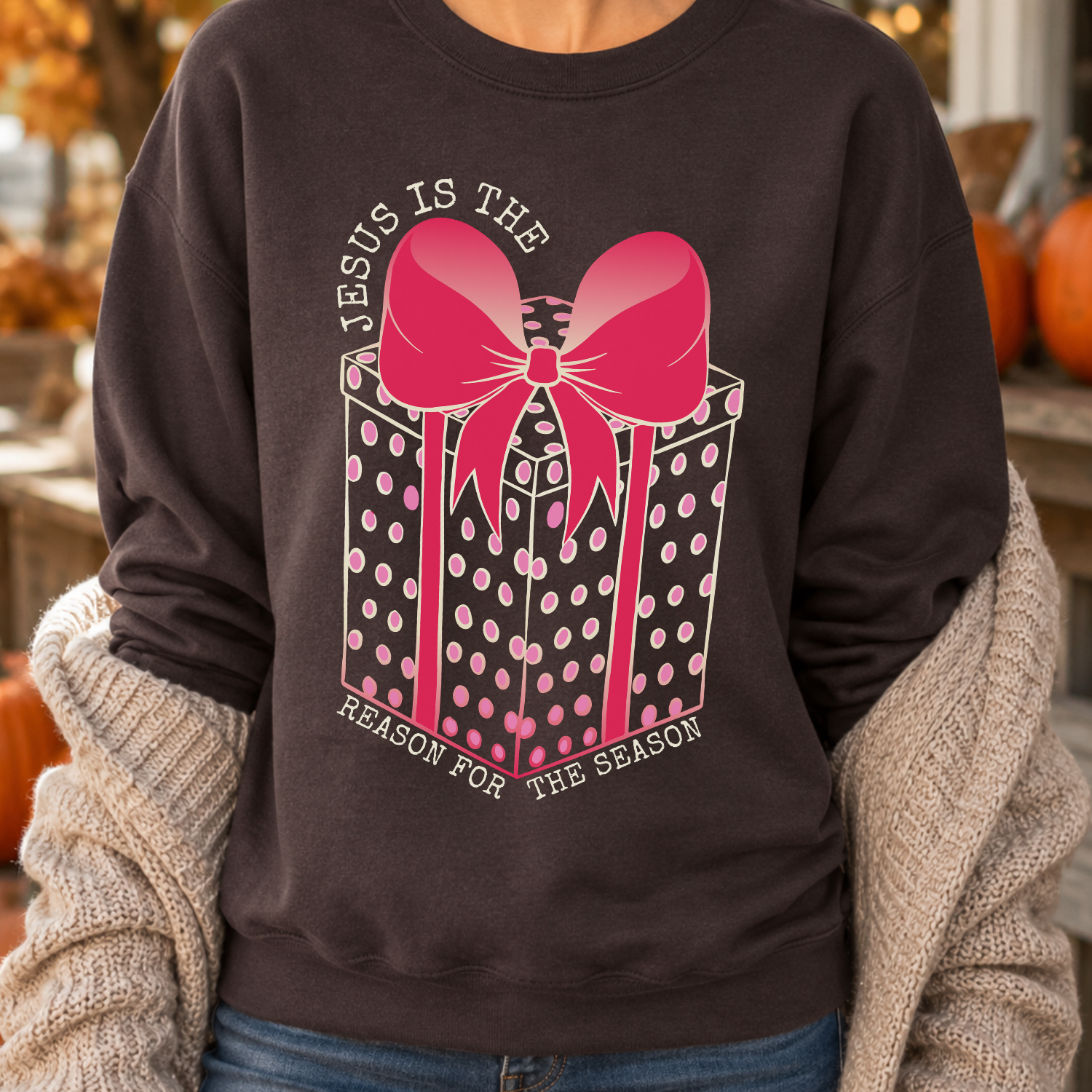 Jesus Is The Reason For The Season Christian Christmas Graphic Sweatshirt available on a Chocolate, Heliconia PInk and Sand Crewneck