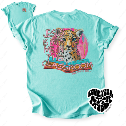 Faith-based teacher graphic with text “Jesus Is With Me in the Classroom,” high-contrast painted style artwork with intentional imperfection, printed on a Comfort Colors® tee.