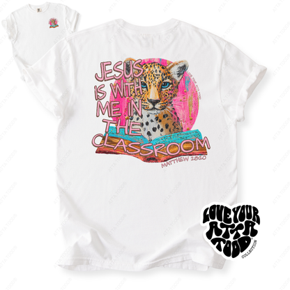 Faith-based teacher graphic with text “Jesus Is With Me in the Classroom,” high-contrast painted style artwork with intentional imperfection, printed on a Comfort Colors® tee.