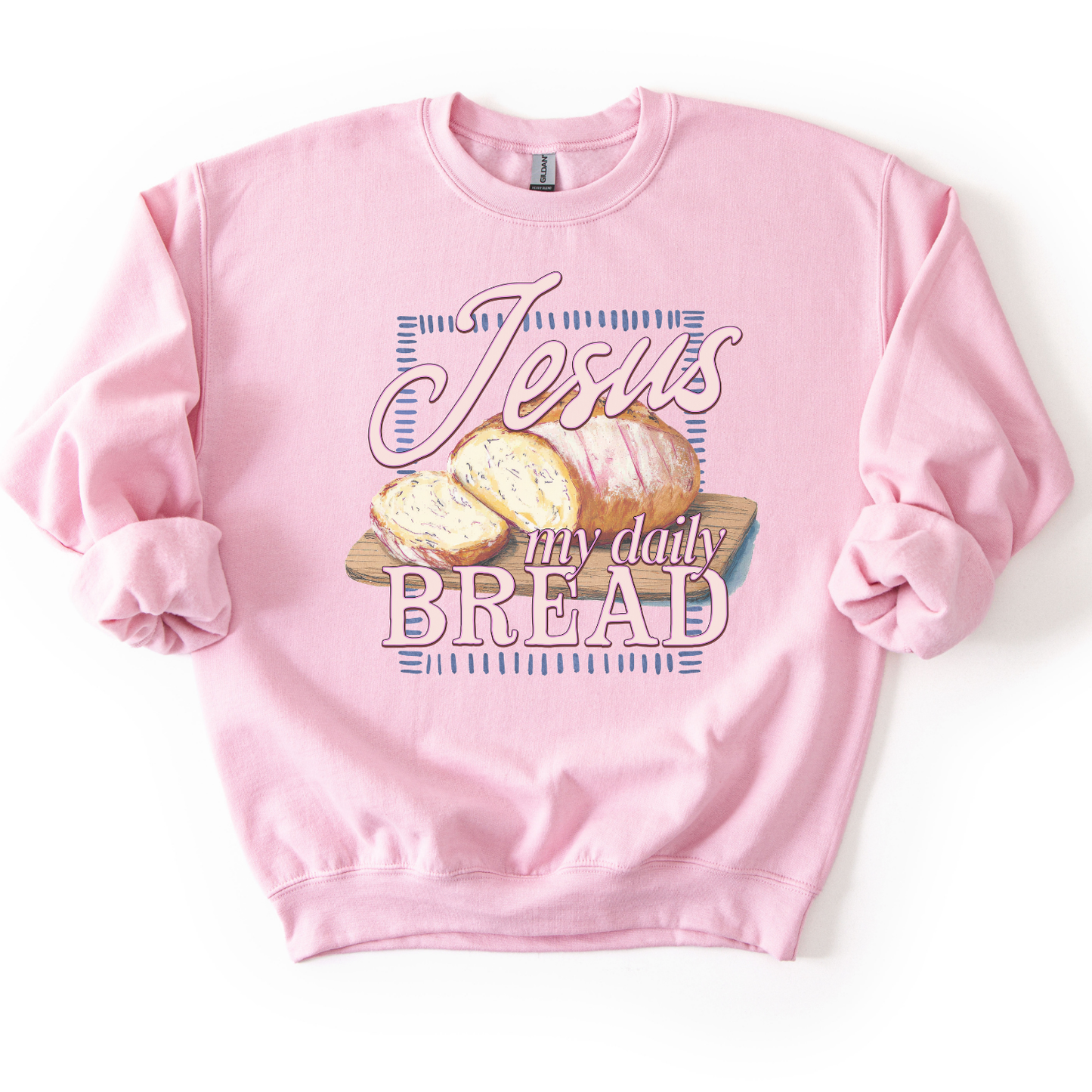 Light pink sweatshirt with 'Jesus my daily BREAD' text and bread graphic on a white background