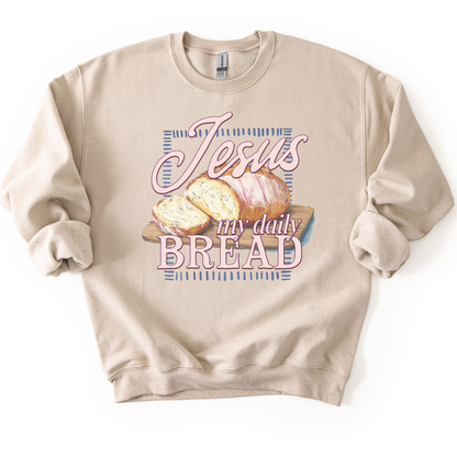 Sand sweatshirt with 'Jesus my daily BREAD' text and bread graphic on a white background