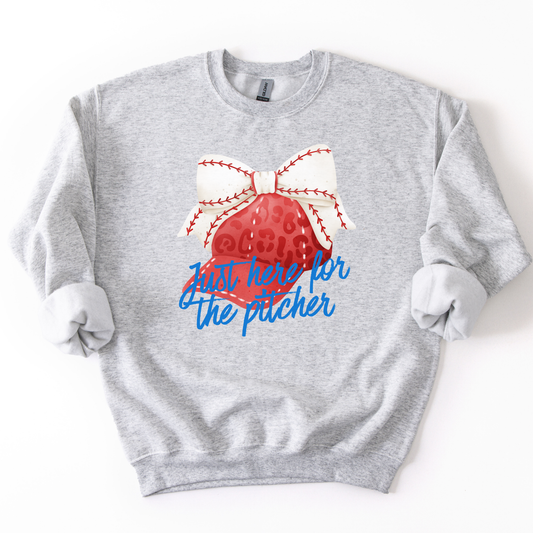 Gray sweatshirt with a baseball and bow design and text 'Just here for the pitcher' on a white background