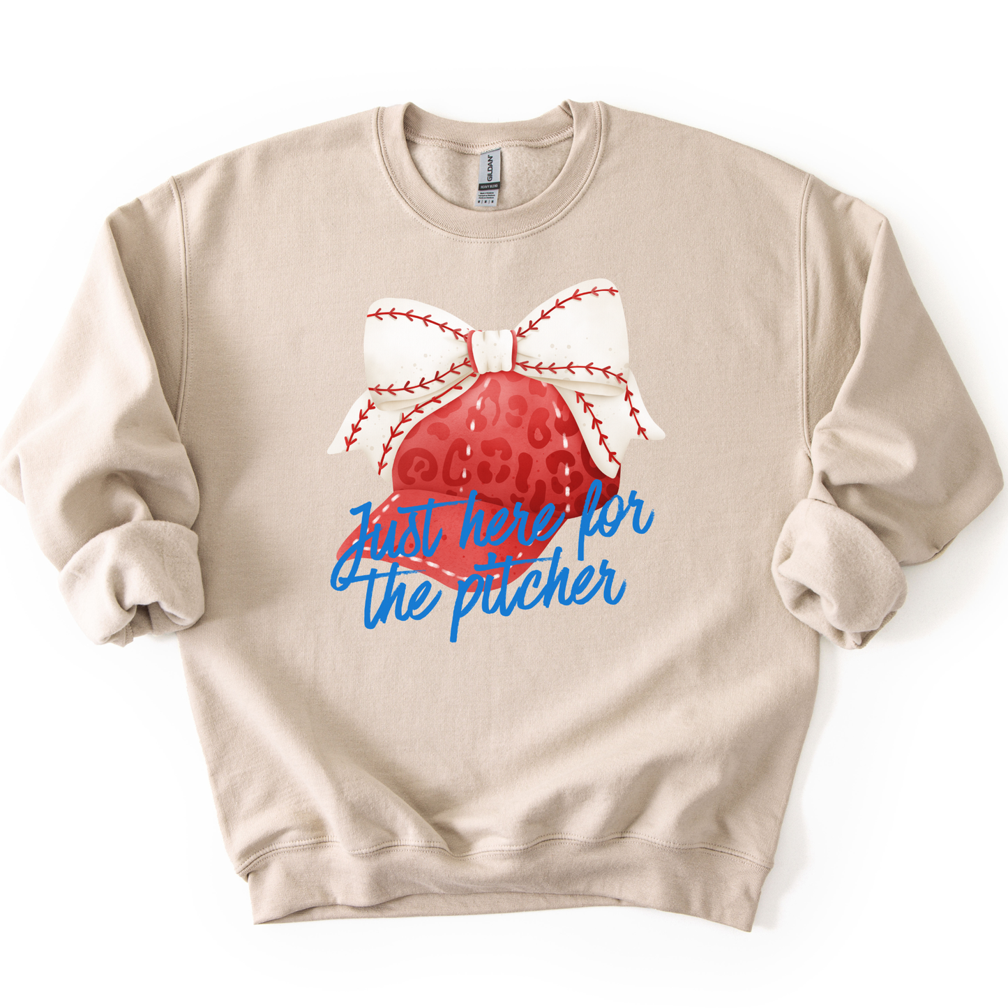 Beige sweatshirt with a red heart and white bow design on a white background