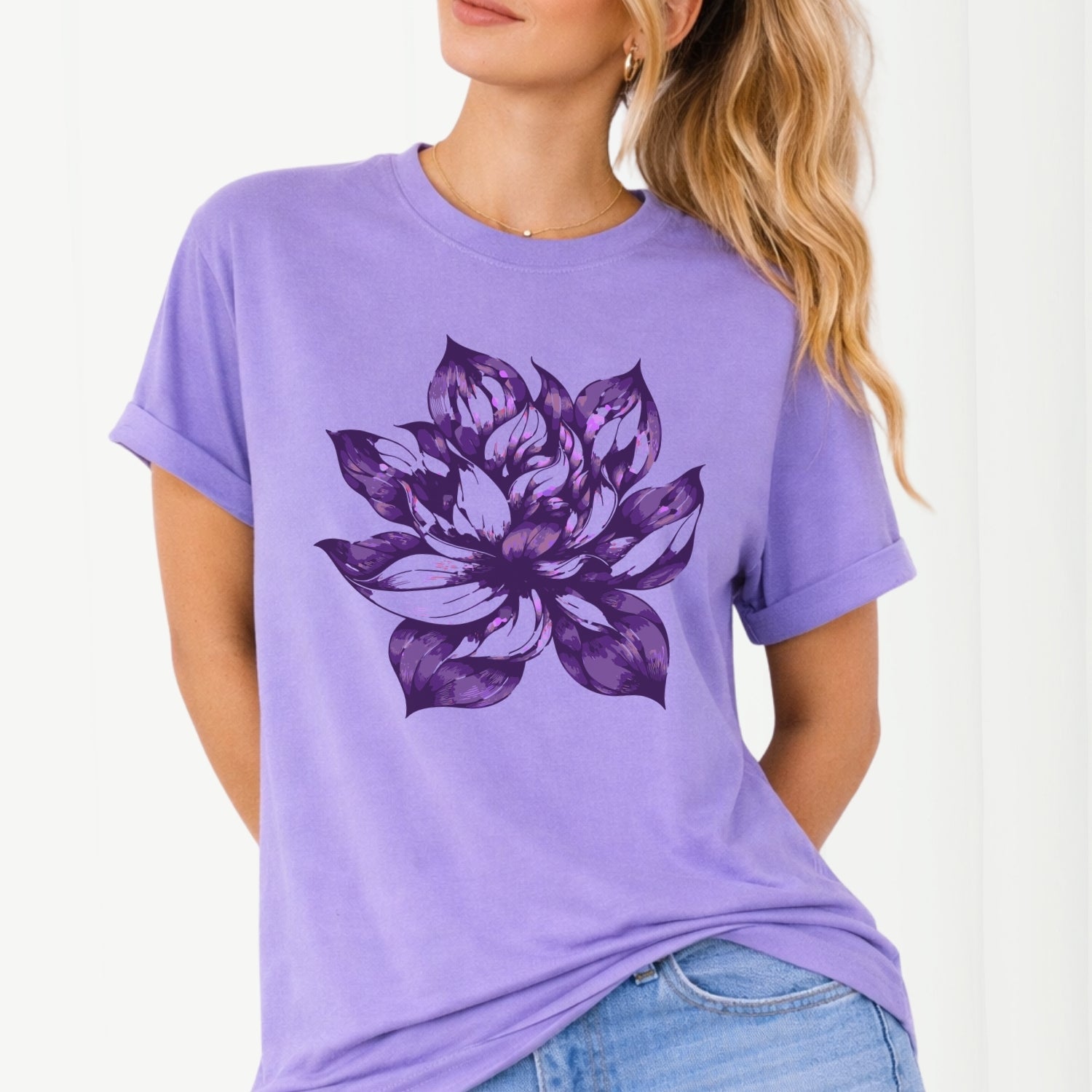 Person wearing a purple t-shirt with a large purple flower design on a white background