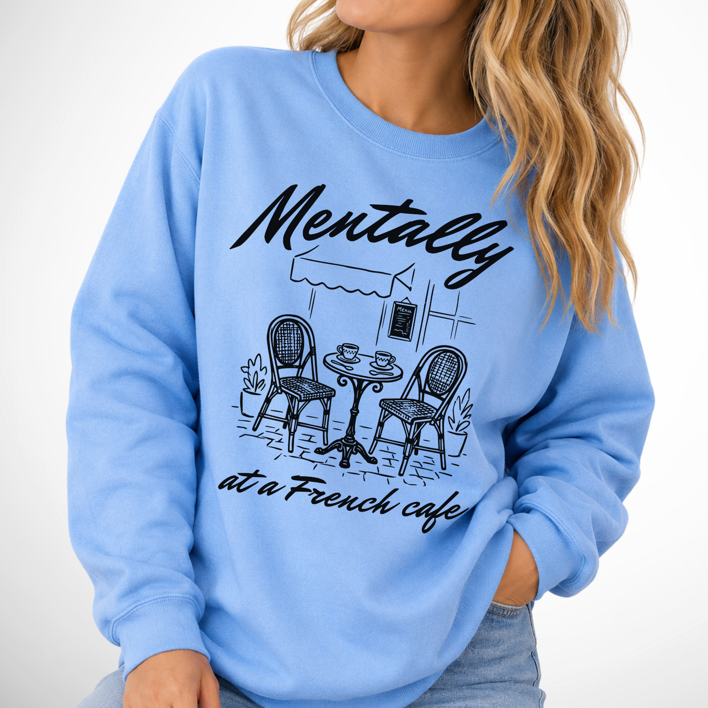 Mentally at a french cafe graphic on a carolina blue sweatshirt