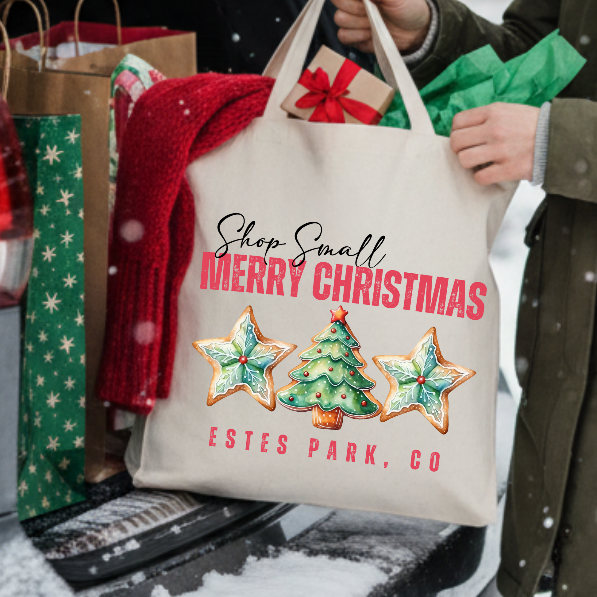 Canvas tote bag that says shop small Merry Christmas.  3 large Christmas cookies graphic. Customizable tote with business name, city and state or both