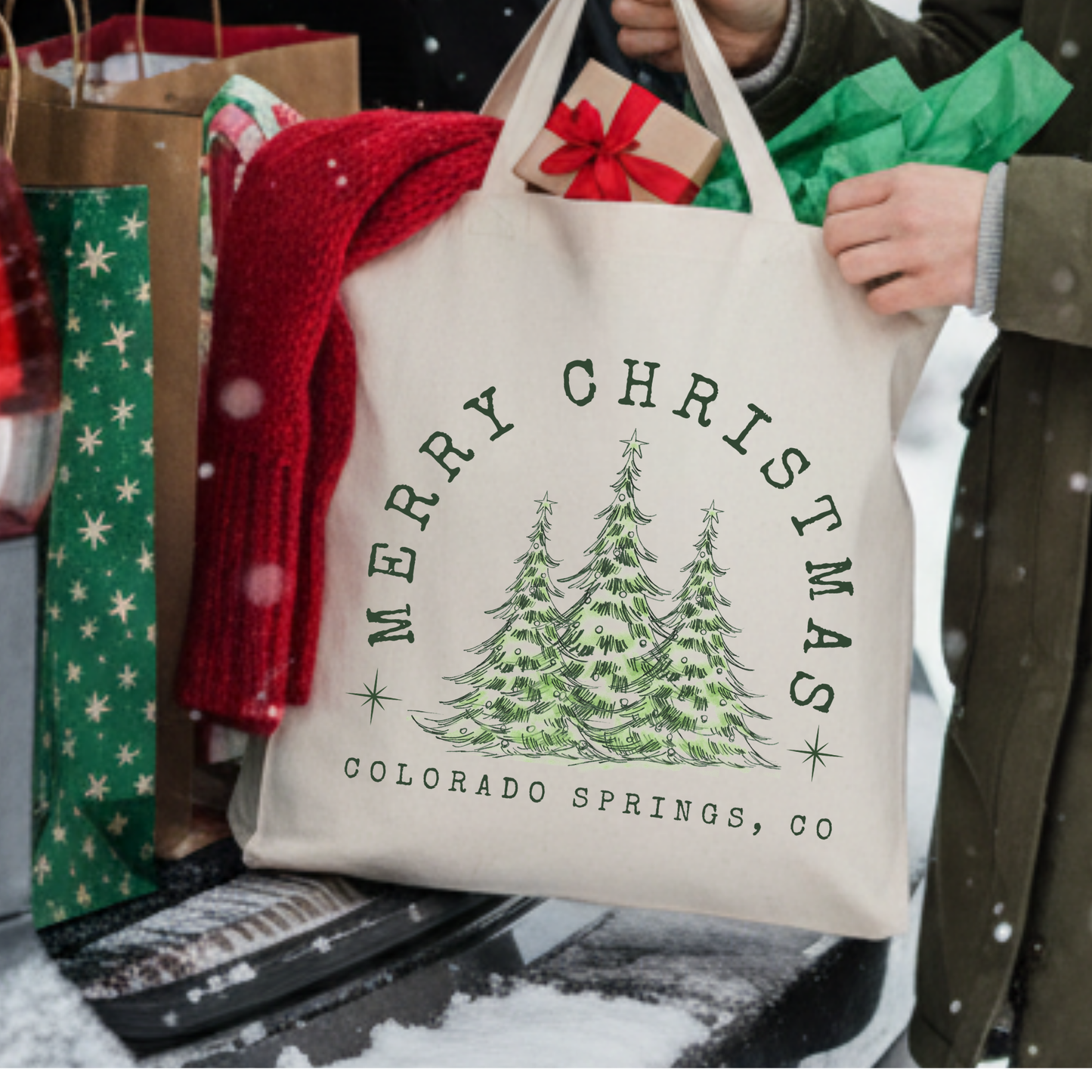Canvas tote bag with 3 large green Christmas trees.  Tote bag says Merry Christmas. Customizable tote with business name, city and state or both