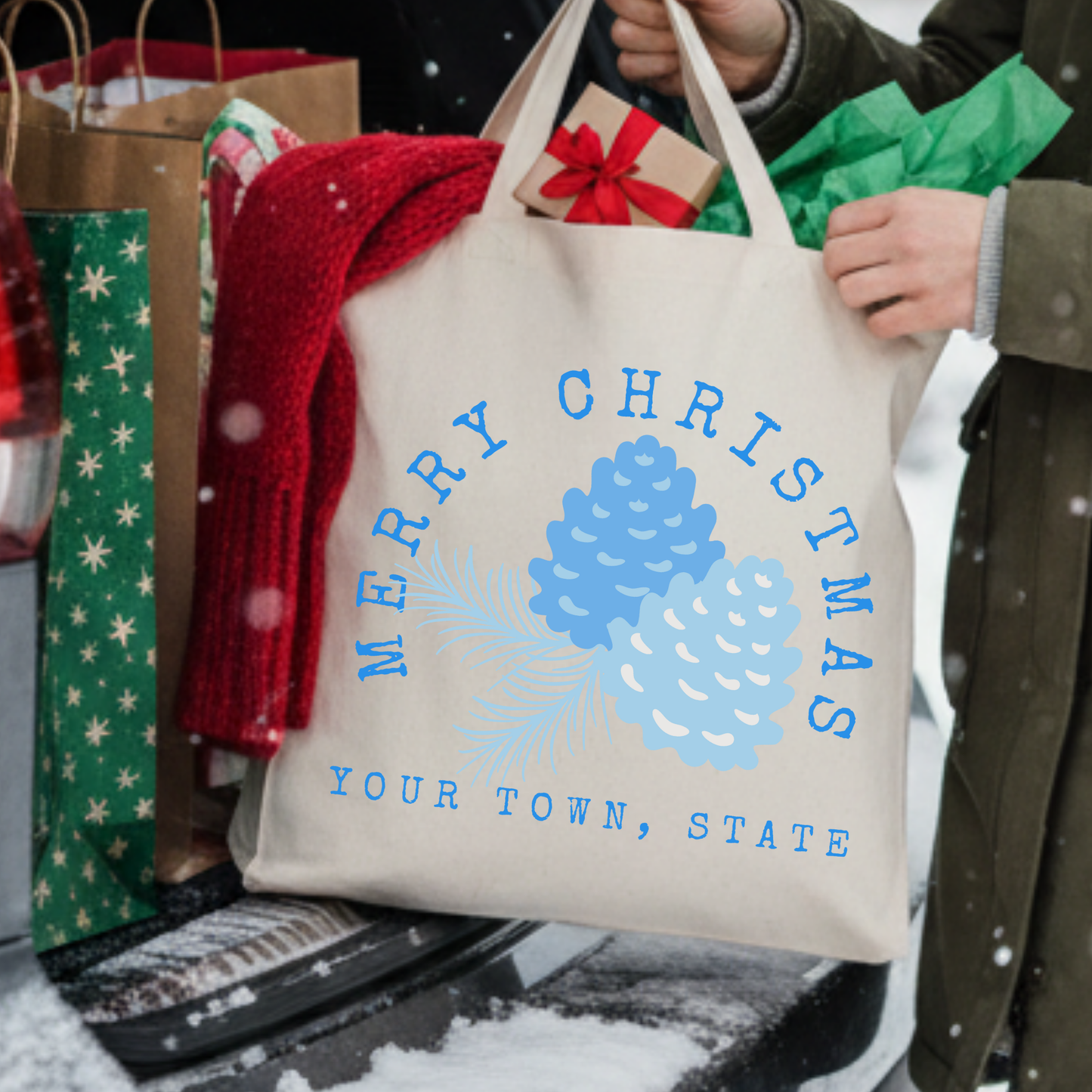 Merry Christmas blue pine cones tote bag.  Personalized with business name or town and state