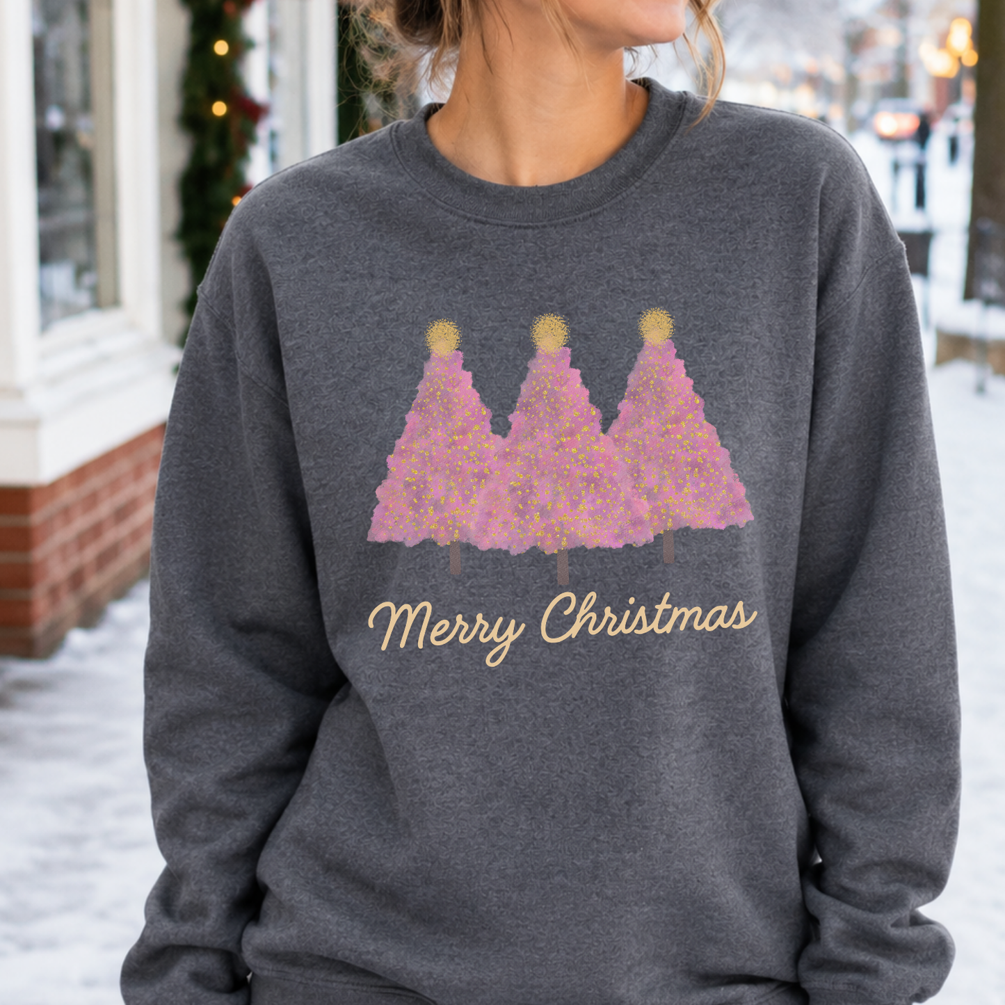 Merry Christmas Pink Christmas Trees Graphic on a dark heather gray Sweatshirt