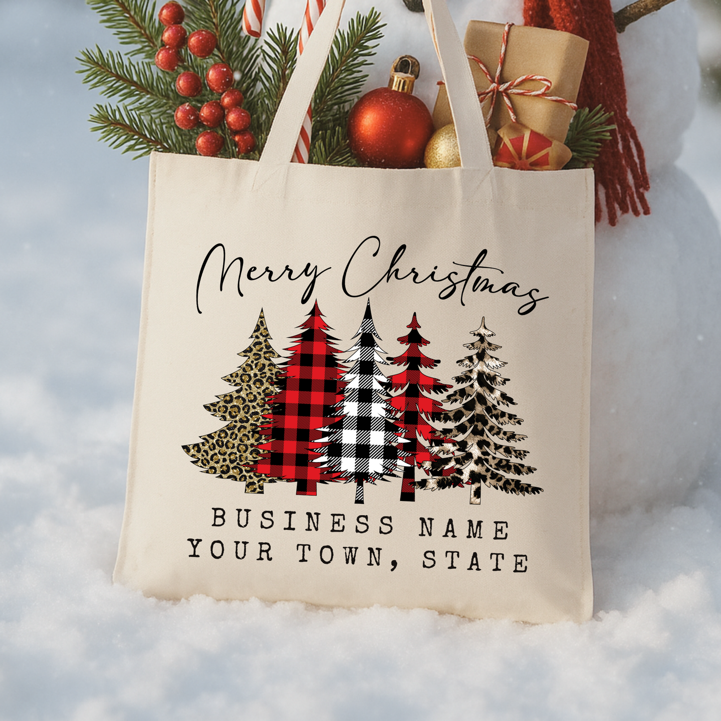 canvas tote bag that says Merry Christmas with 5 Christmas trees in buffalo plaid print and leopard print.  Personalize tote with business name or city and state. 