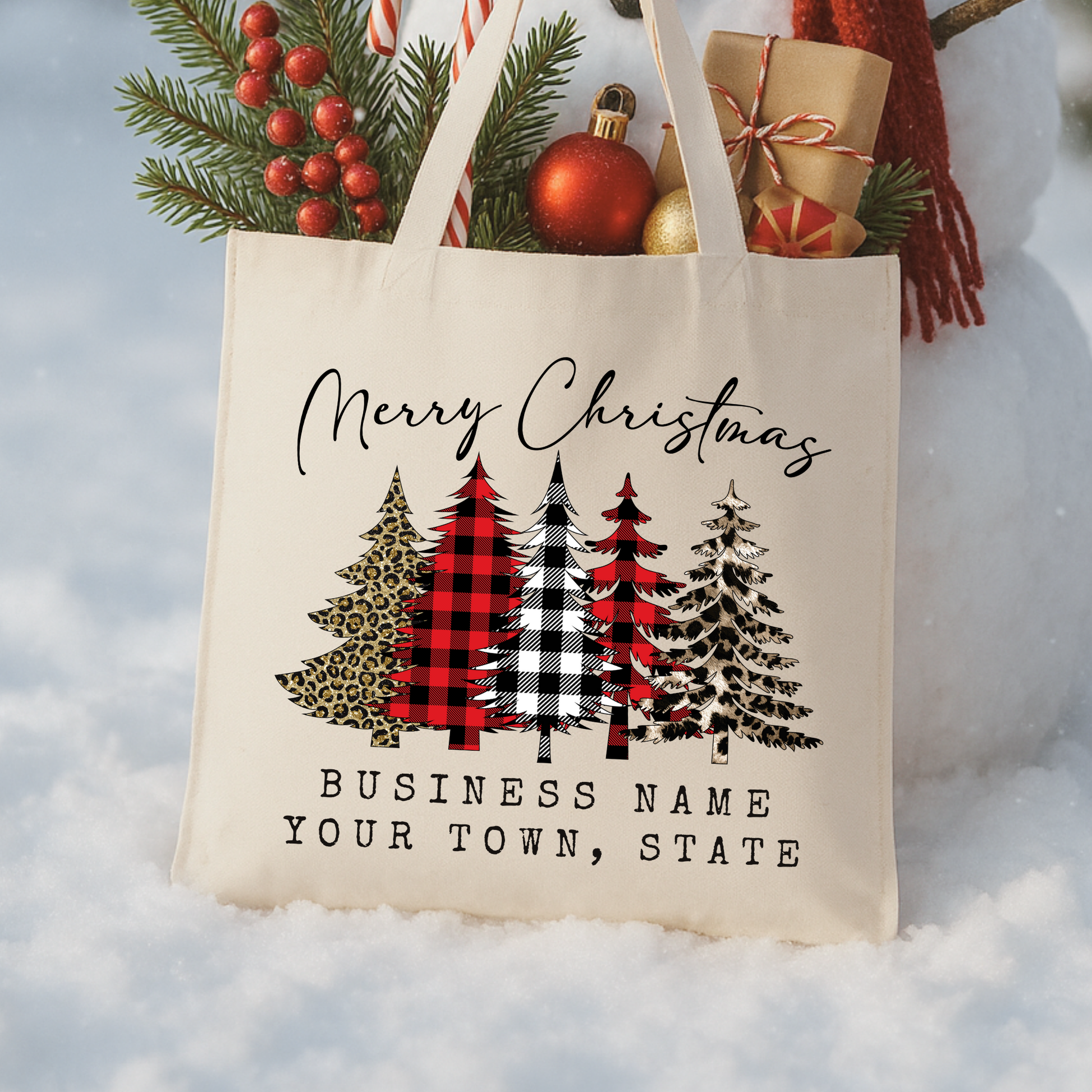 canvas tote bag that says Merry Christmas with 5 Christmas trees in buffalo plaid print and leopard print.  Personalize tote with business name or city and state. 