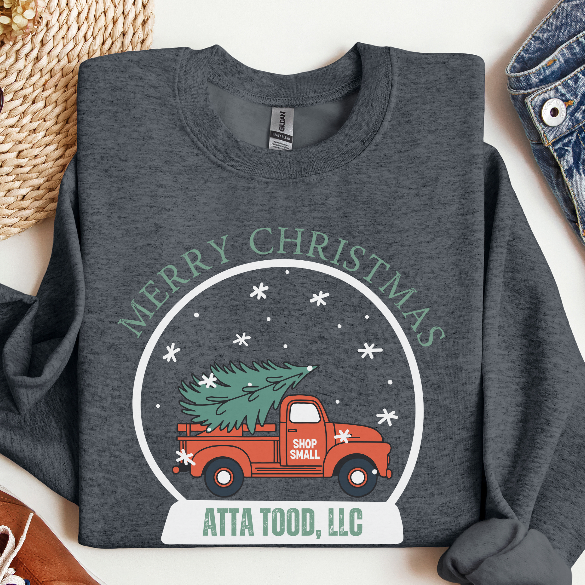 snow globe of a vintage red truck with a Christmas tree in the back that you can customize with your zip code, business name, city and state, or shop small.  Dark Heather gray sweatshirt