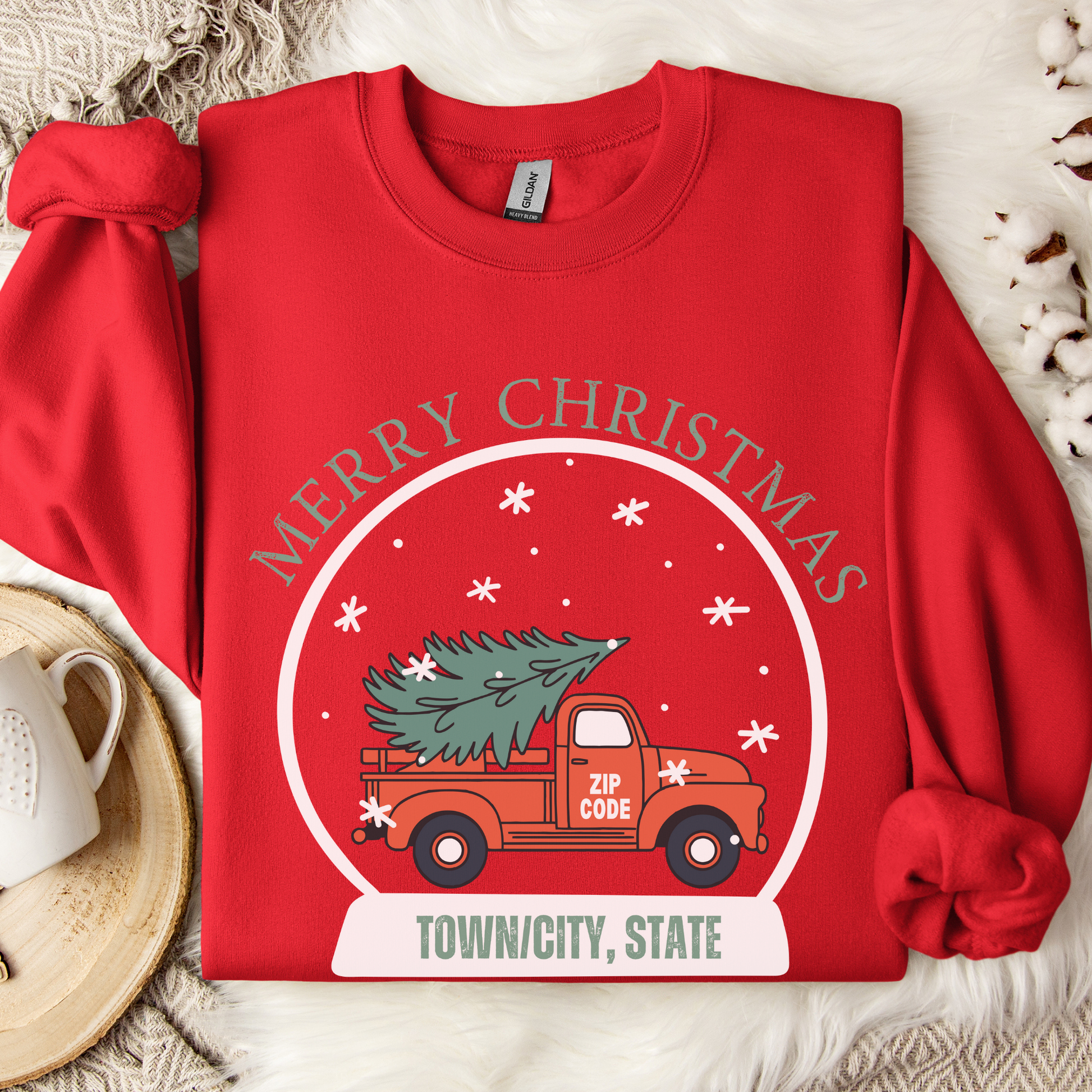 snow globe of a vintage red truck with a Christmas tree in the back that you can customize with your zip code, business name, city and state, or shop small.  Red sweatshirt