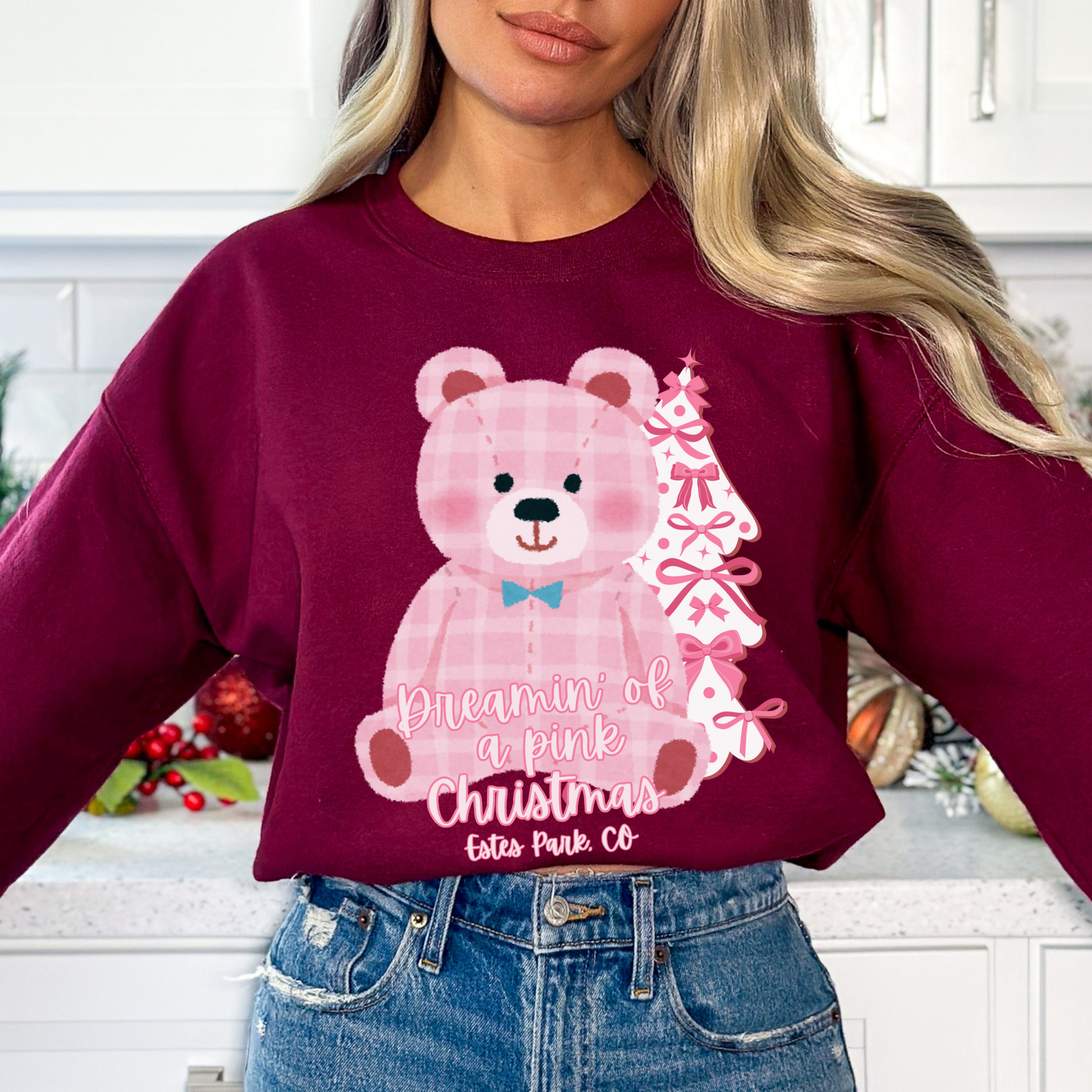 oversize pink plaid teddybear with white Christmas tree with pink bows on a maroon sweatshirt. Text says Dreamin of a pink Christmas Customize with business name, city, state or both.