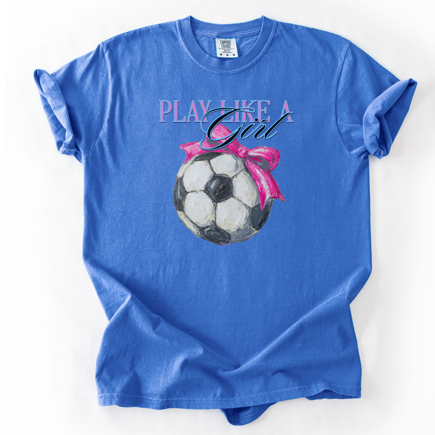 Blue t-shirt with soccer ball graphic and 'Play Like a Girl' text on a white background