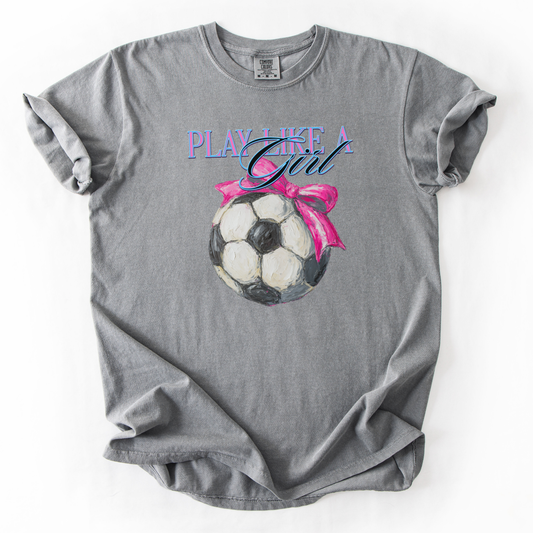 Gray t-shirt with soccer ball graphic and 'Play Like a Girl' text on a white background