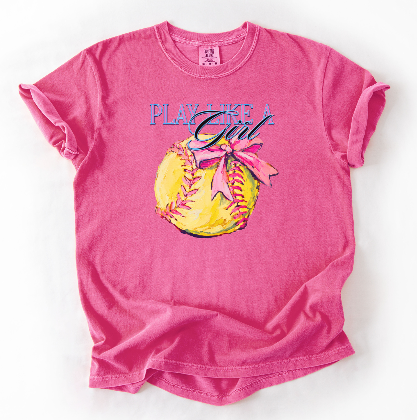 pink t-shirt with a graphic of a softball and text 'Play Like a Girl' on a white background