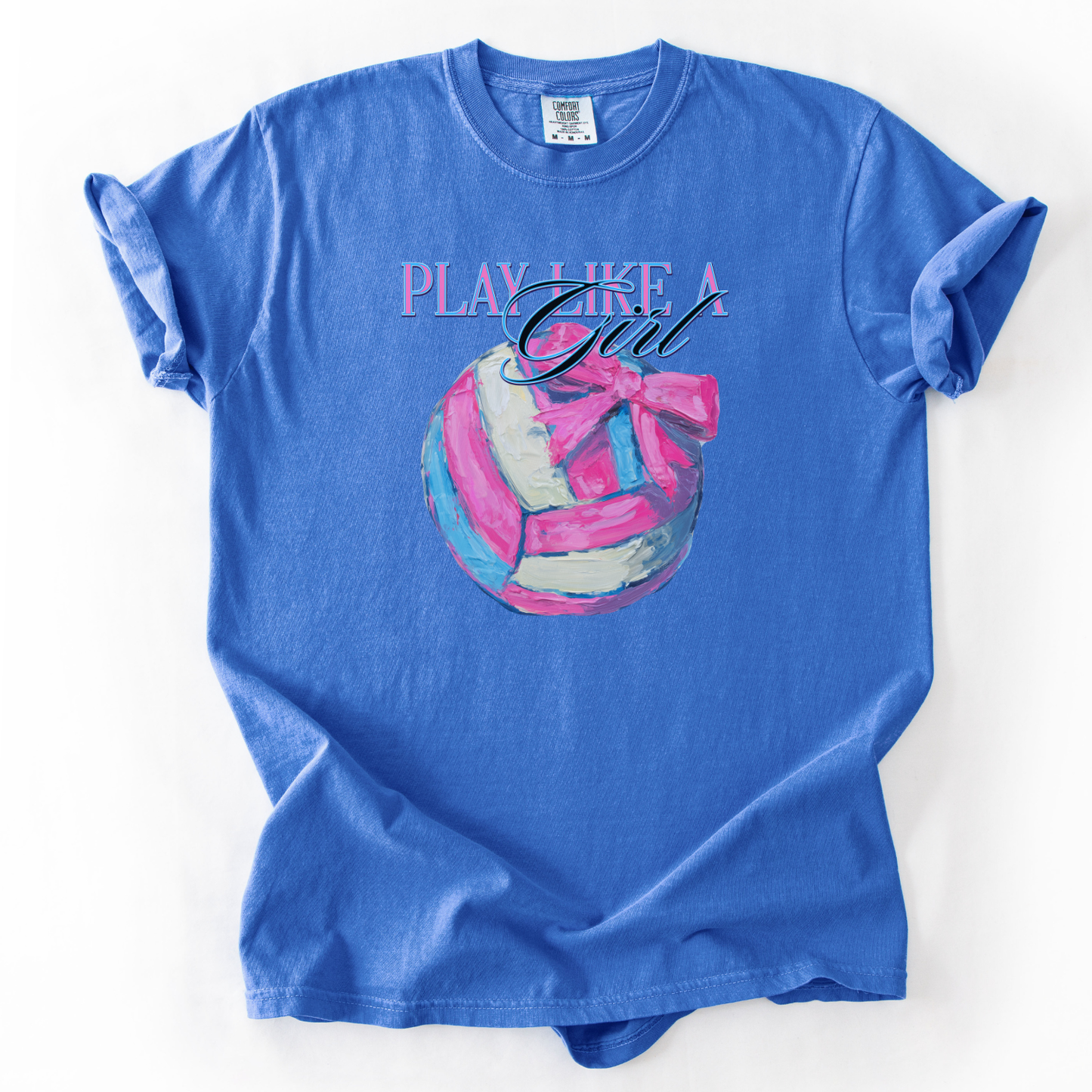 Play like a girl pink blue and white volleyball graphic with a bow on a flo blue comfort colors tee