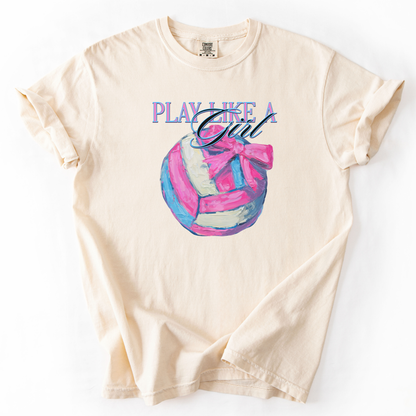 Play like a girl pink blue and white volleyball graphic with a bow on an ivory comfort colors tee