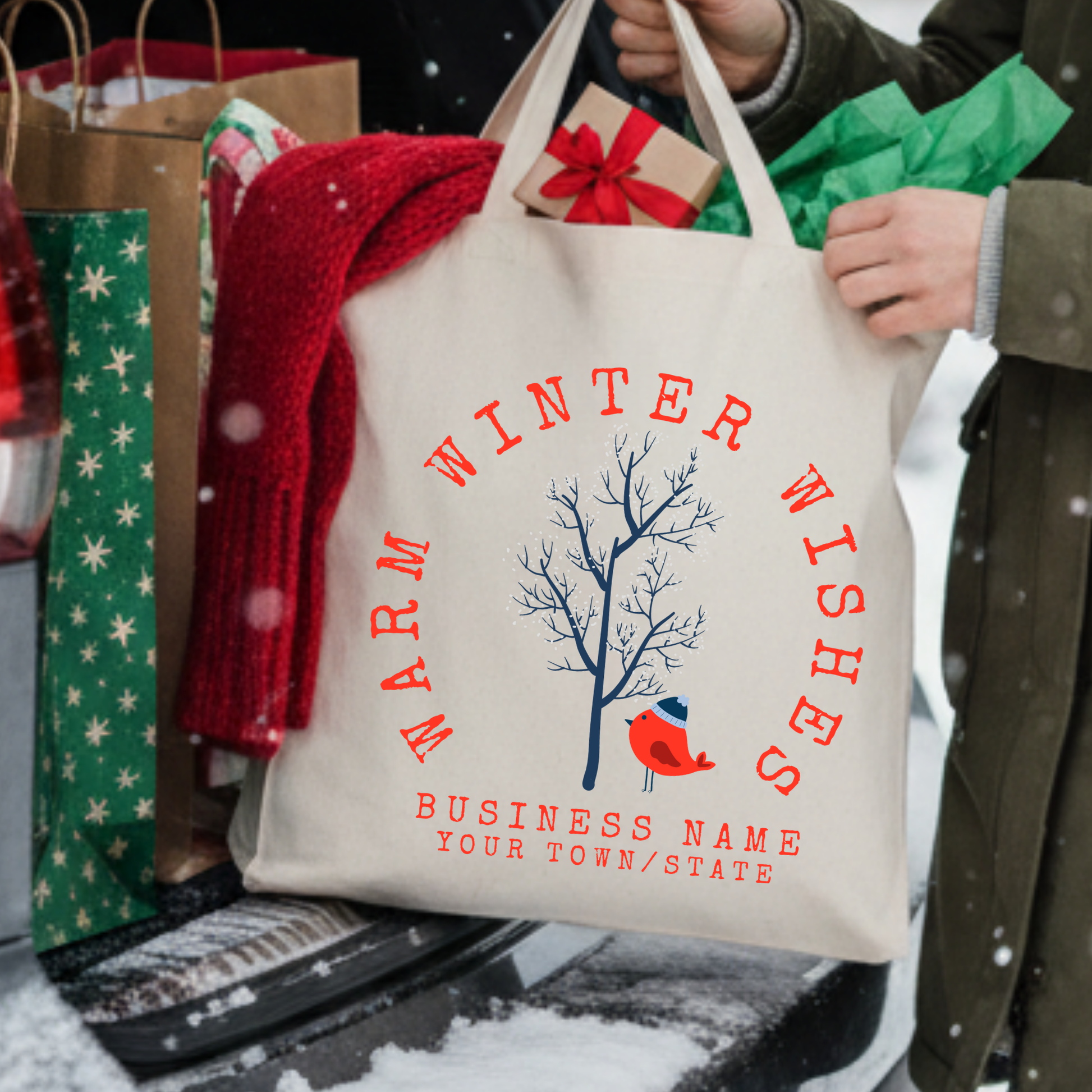 Warm winter wishes custom Christmas tote bage featuring a small tree with snow and a red bird with a blue beanie hat