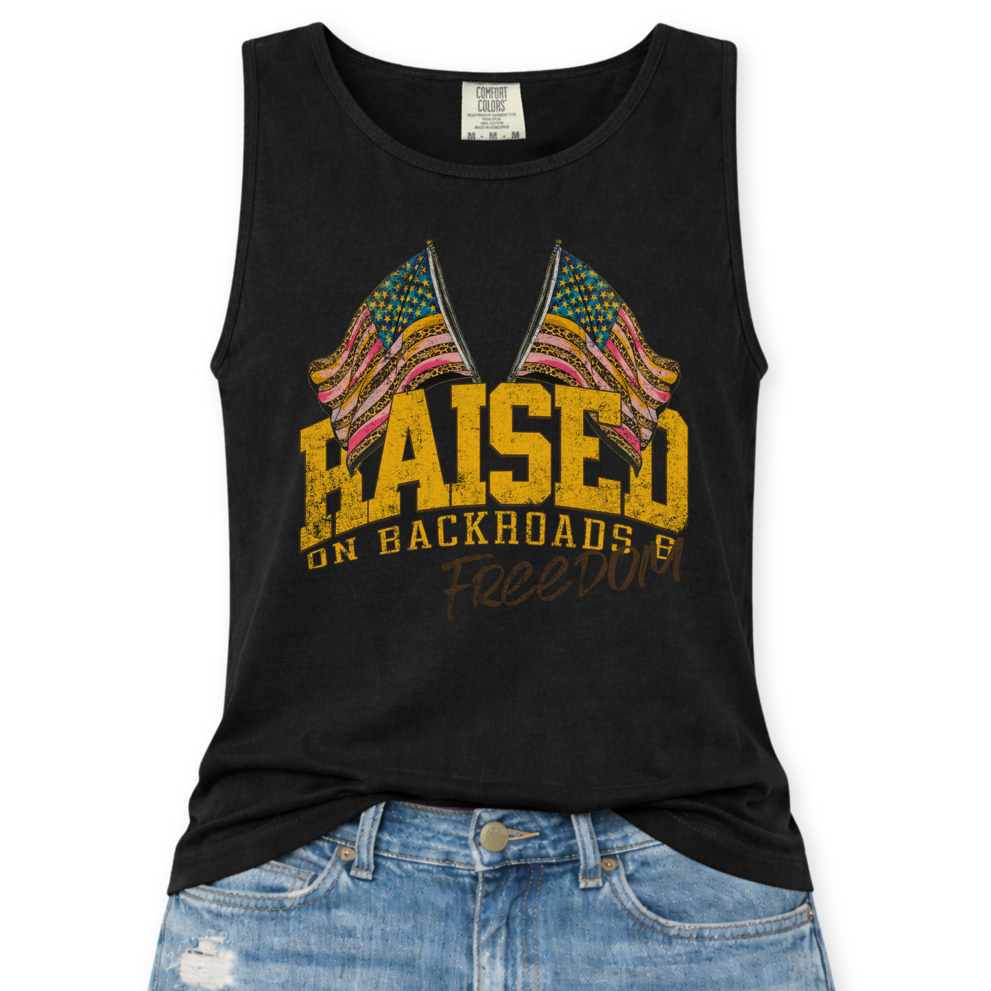 Black tank top with colorful graphic and text 'Raised on Backroads and Freedom' displayed on a white background.