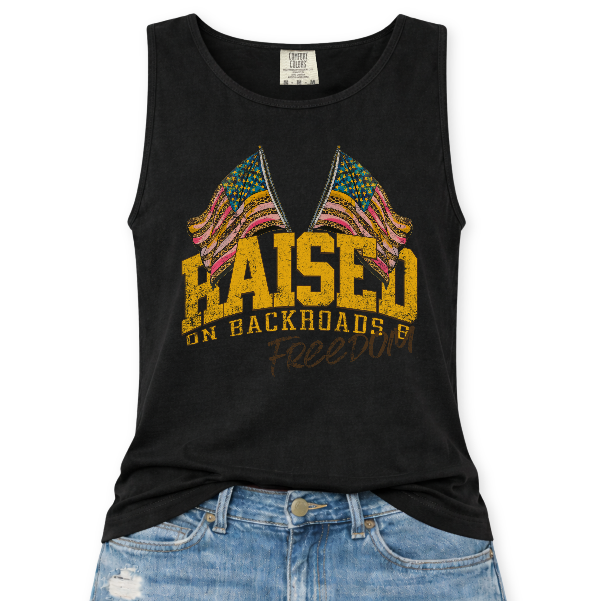 Black tank top with colorful graphic and text 'Raised on Backroads and Freedom' displayed on a white background.