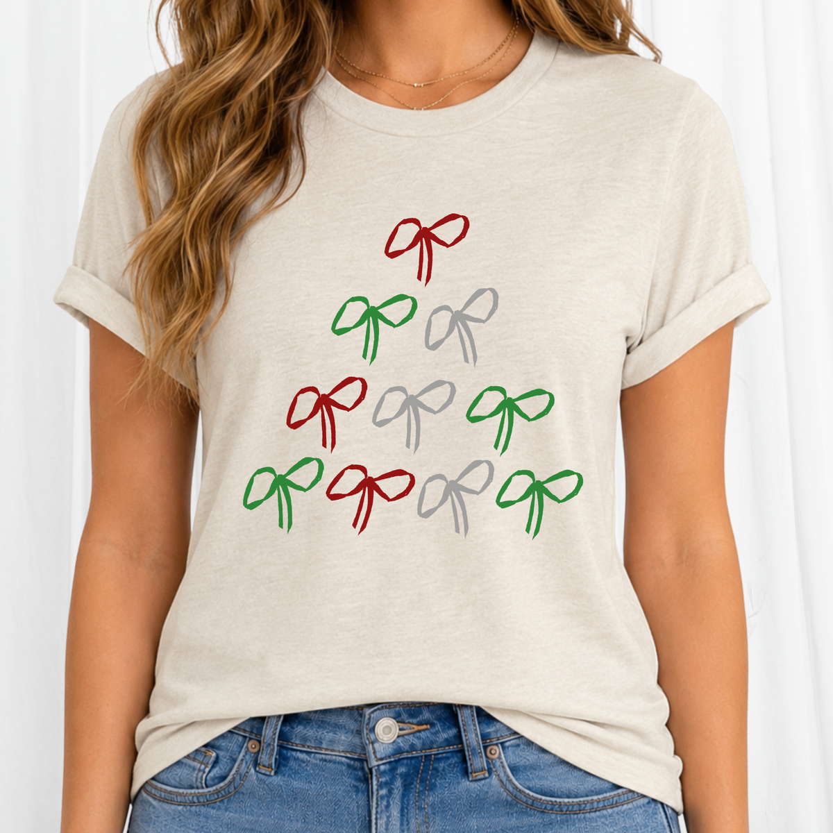A simple Christmas tree made from doodle bows in classic red, green, and silver on heather oatmeal shirt