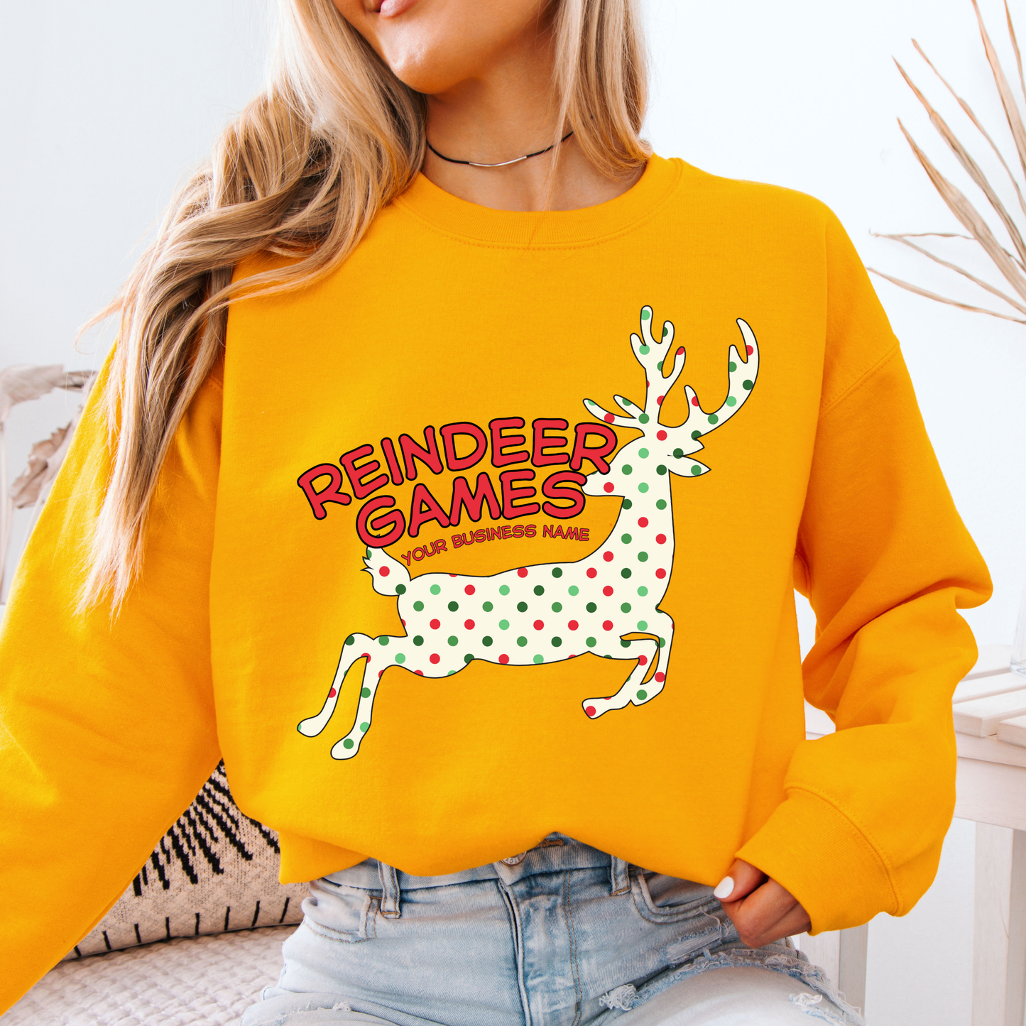 yellow sweatshirt with a polka dot reindeer.  Test says reindeer games.  You can customize the sweatshirt with business name, town and state or both
