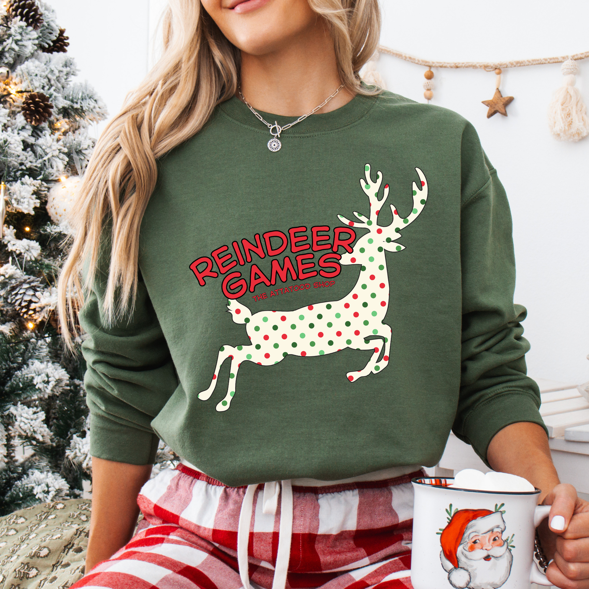 green sweatshirt with a polka dot reindeer.  Test says reindeer games.  You can customize the sweatshirt with business name, town and state or both