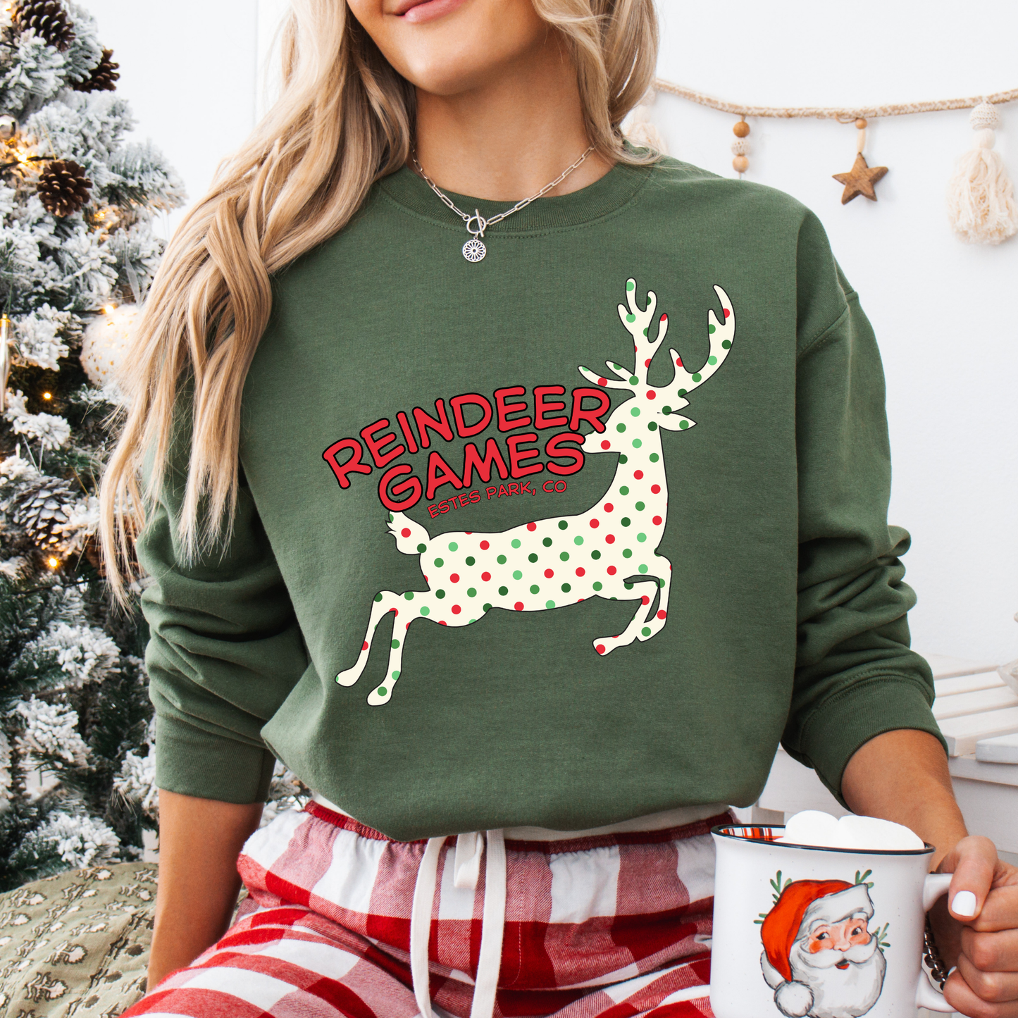 green sweatshirt with a polka dot reindeer.  Test says reindeer games.  You can customize the sweatshirt with business name, town and state or both