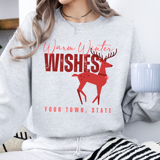 Gray sweatshirt with red reindeer design That says Warm winter wishes in red. Below design is a place to customize the sweatshirt with your business name, town and state or both.