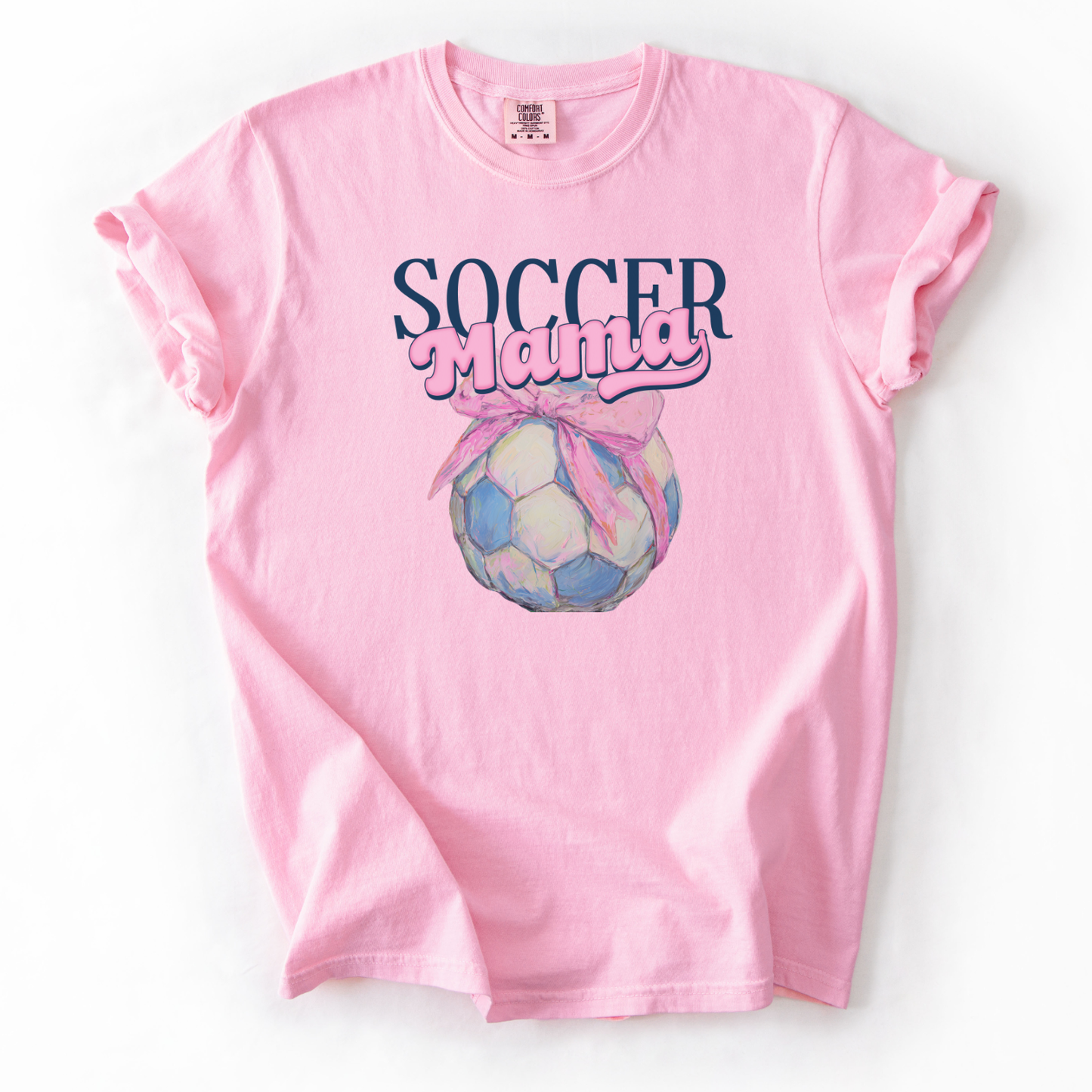 Pink t-shirt with 'Soccer Mama' soccer with a bow graphic on a white background