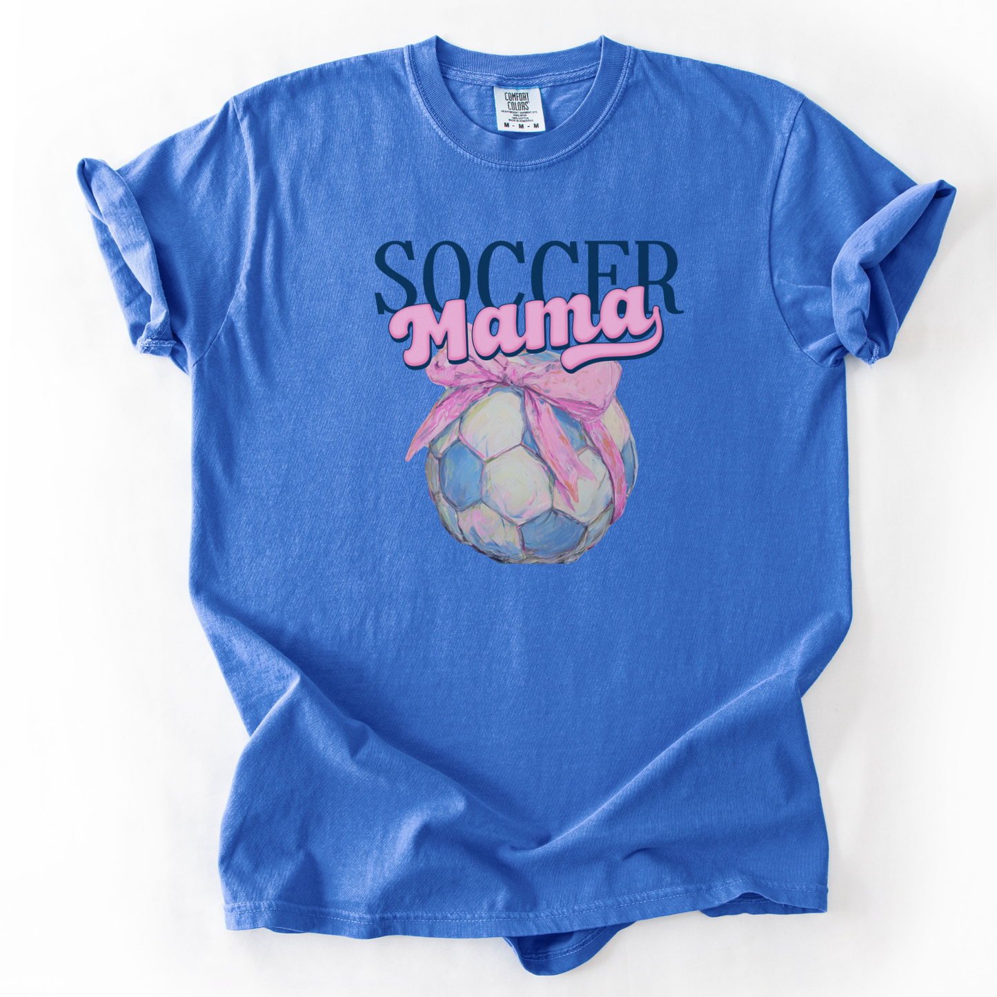 blue t-shirt with 'Soccer Mama' soccer with a bow graphic on a white background