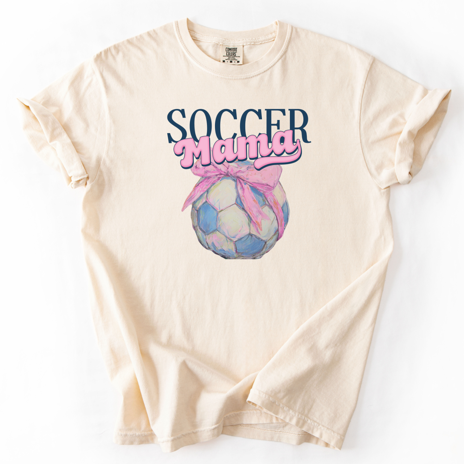 ivory t-shirt with 'Soccer Mama' soccer with a bow graphic on a white background