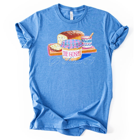 Blue t-shirt with a graphic design of bread, jam, and a jar labeled 'The Gospel According to Jelly' on a white background.