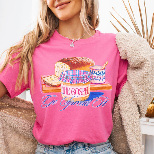 pink "Go spread the gospel" featuring loaf of bread and jam graphic on a premium soft Bella Canvas Unisex tee.&nbsp;