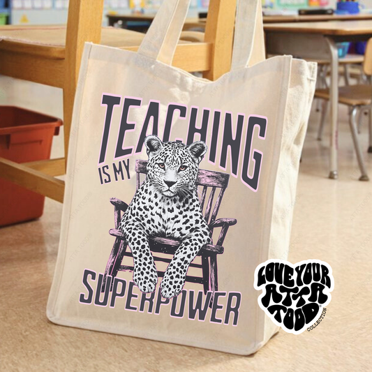 Tote bag with a leopard graphic and text 'Teaching is my superpower' in a classroom setting.