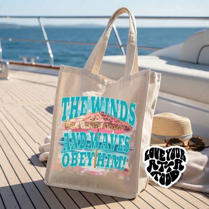Jumbo tote bag the features a  pink leopard print beach umbrella that says The winds and waves obey him