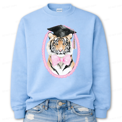 Light blue sweatshirt with a tiger wearing a graduation cap and pink bow tie design.