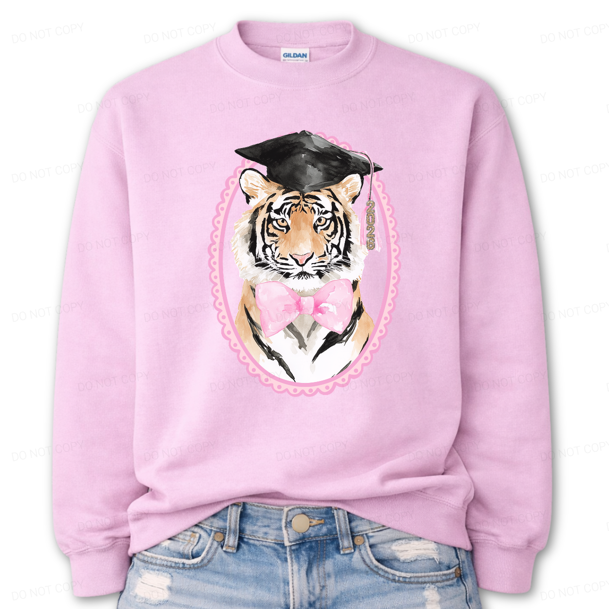 Pink sweatshirt with a tiger wearing a graduation cap and gown design on a white background