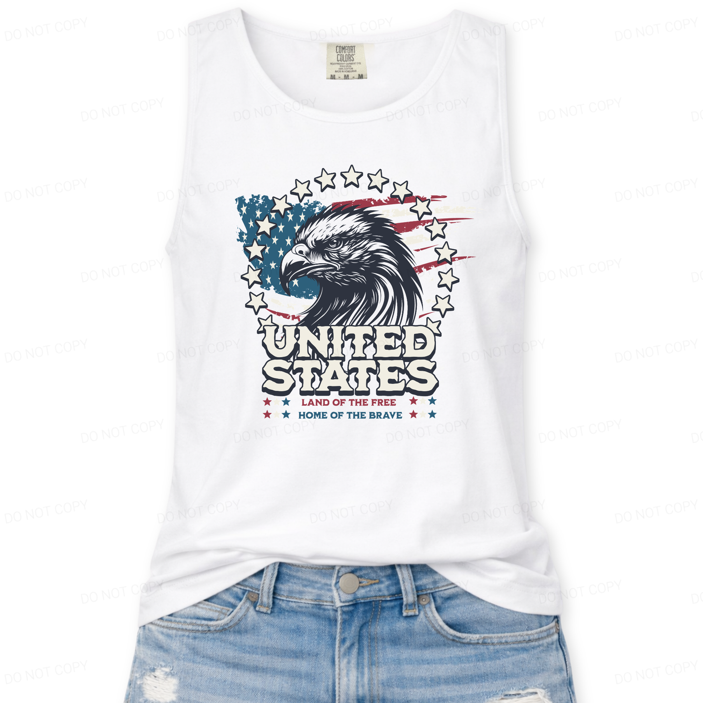 White tank top with American flag design and text, paired with blue jeans on a white background
